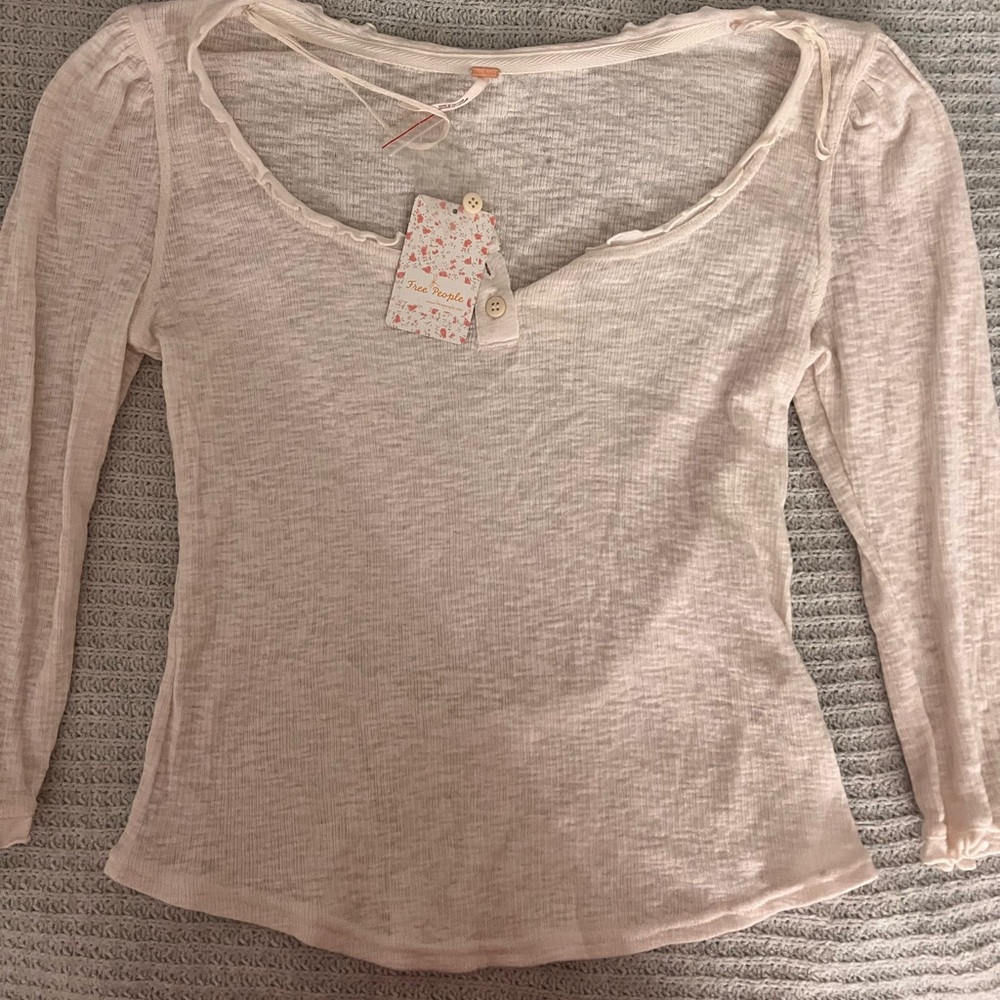 New with tags: Free People cream blouse, size large poshmark